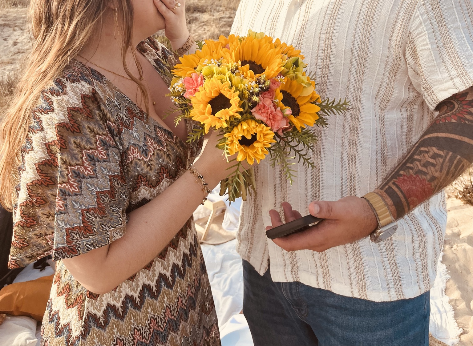 A couple with flowers after a proposal